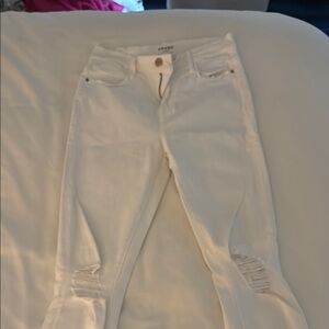 Frame jeans with rips in the knees